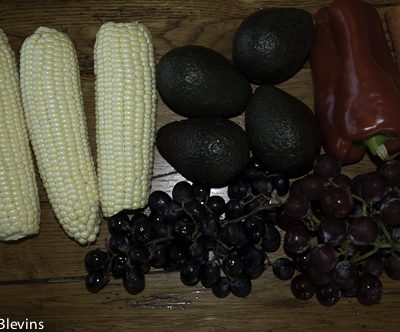 Vegetables - corn, red pepper and fruits grapes avocados