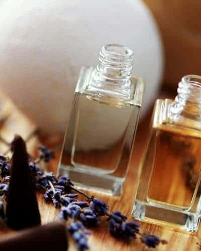 fun ways to use essential oils in your home - image with dryer balls made from wool and essential oils.