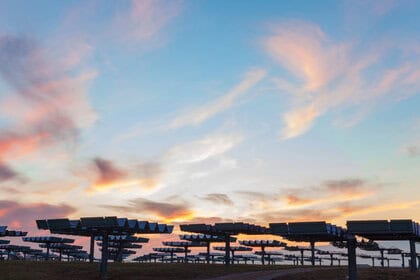 Large solar panel array at sunset representing global solar capacity crossing the 3-terawatt milestone in 2026, a clean energy record