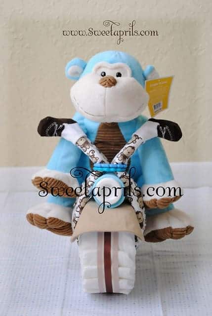 Monkey Motorcycle Diaper Cake Tutorial. 15 Creative Diaper Cakes. Amazing Baby Shower Party Ideas, crafts and homemade gifts.