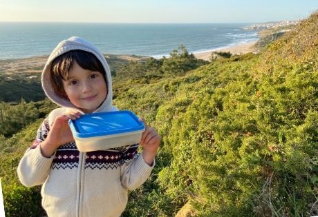 Luca with his geocaching find. Geocaching is one of the best things to do in Ericeira