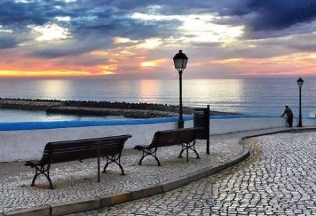 Benches at the ribas. Enjoying the sea view on a bench is one of the incredible experiences tourists enjoy in Ericeira.