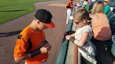 My daughter getting an autograph at the Baysox game