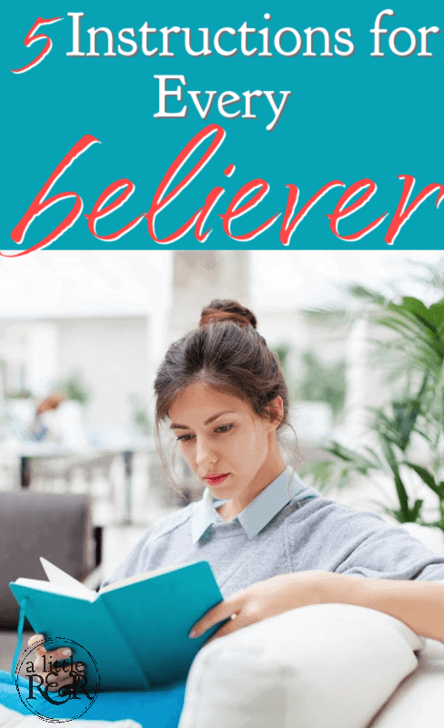 woman siting on couch reading a book with a teal cover