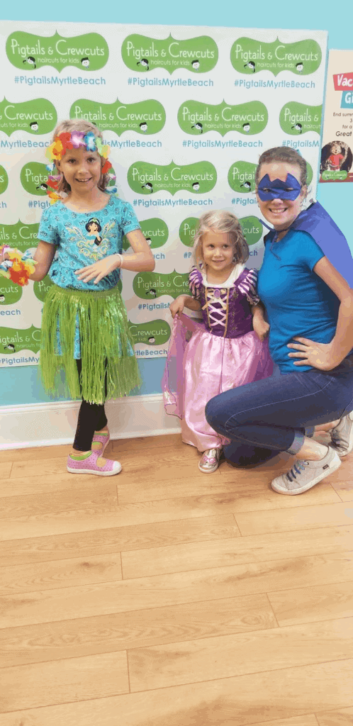 Bobbei Ruswinckel, children's hair salon franchise owner, with two little girls