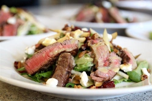 Beef Tenderloin Salad Recipe! With a mix of cranberries and pears, topped with honey mustard dressing, this sweet and tangy salad is addicting.