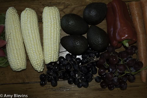 Vegetables - corn, red pepper and fruits grapes avocados