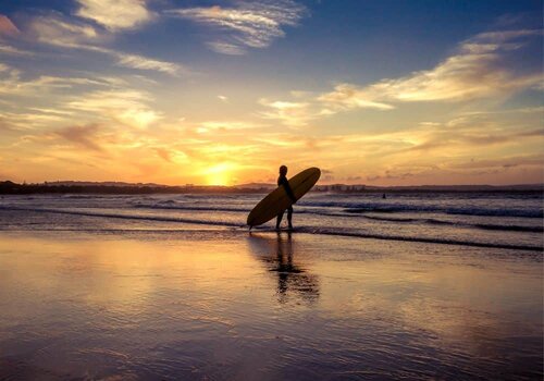 surf schools in Ericeira on the beach at sunset