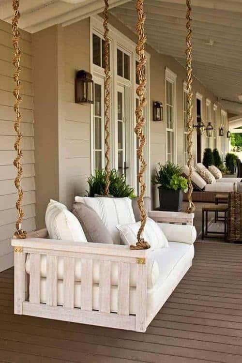 Beautiful hanging swinging porch bed. Love the rope design!