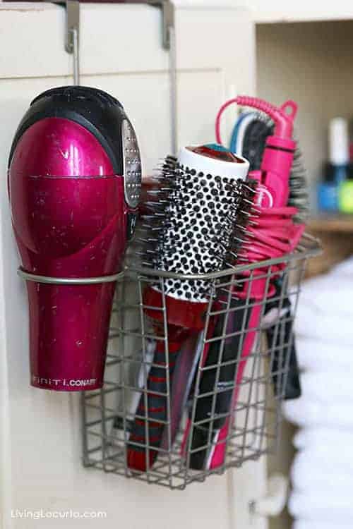 Great Organizing Ideas for your Bathroom! Love this hanging hair dryer and brush storage basket! Cabinet Bathroom Organization Makeover - Before and After photos. 