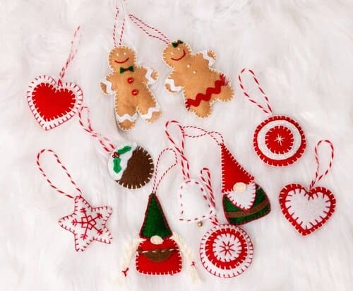 felt ornaments on a white fur background.