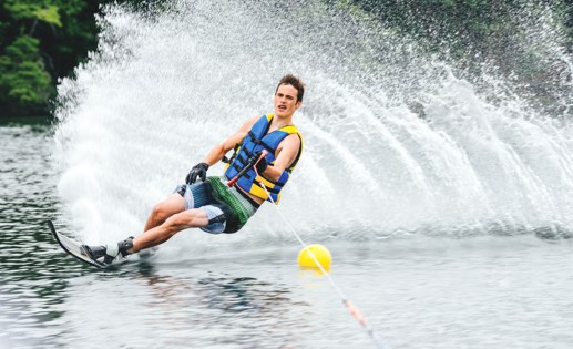 Teen boy waterskiing