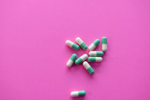 Prescription Capsules Laying on a Table