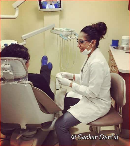 Sachar Dental NYC hygienist with patient Best Teeth Cleaning NYC