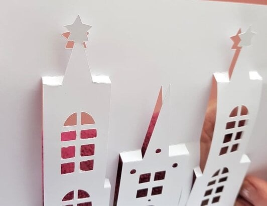 Close up view of the front of the unfinished pop-up castle card to view the folds easily.