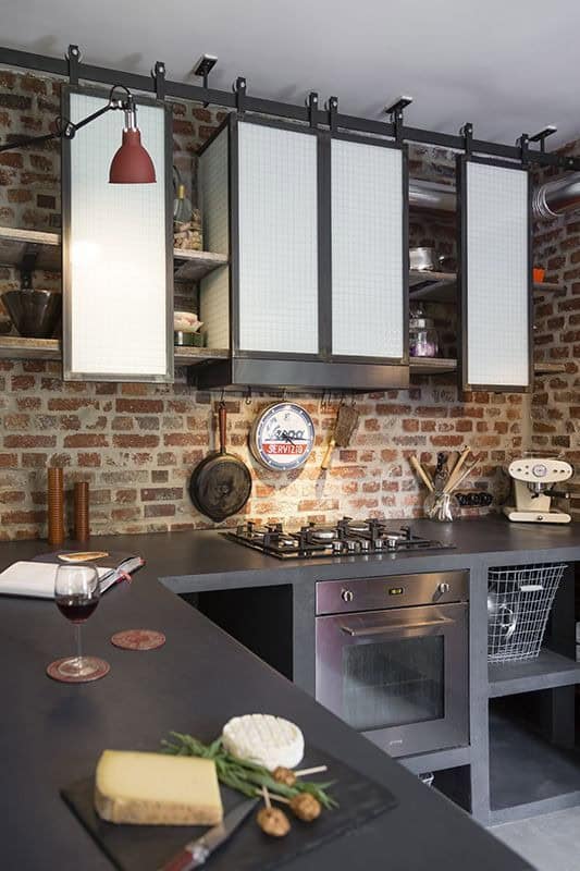 black and white sliding kitchen cabinet door in an industrial kitchen