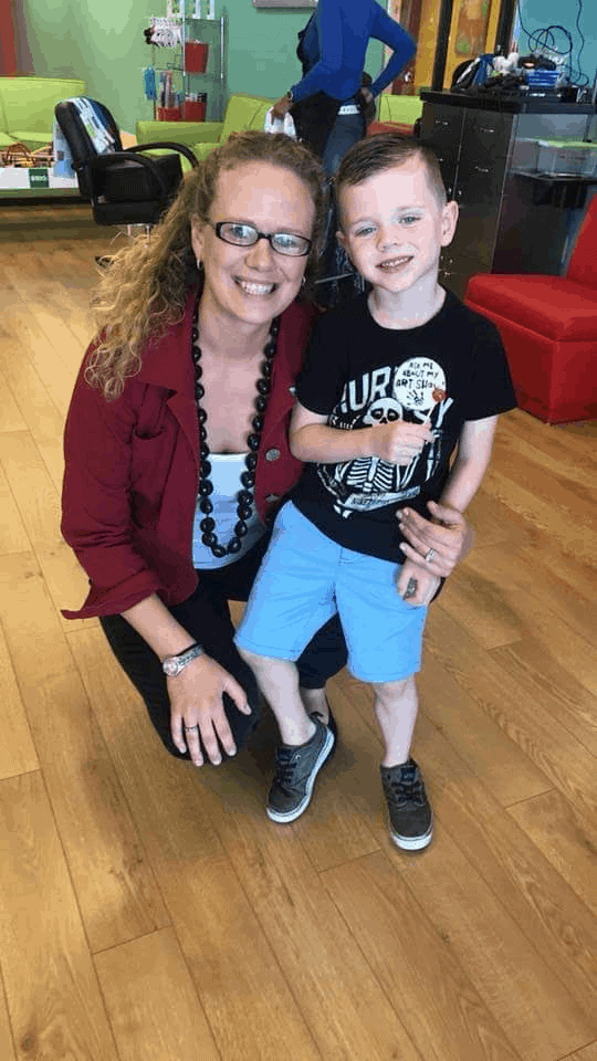 Bobbei Ruswinckel, children's hair salon franchise owner, with small boy