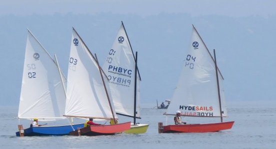 that crease in a lugsail is from insufficient downhaul: storerboatplans.com