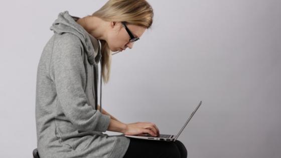 woman with poor posture over laptop