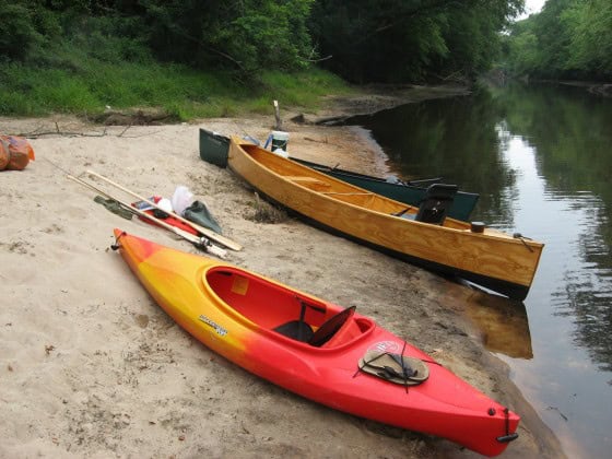 Plywood DIY canoe looks good on the beach.