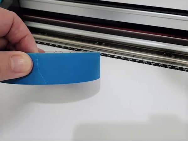 A roll of painters tape used to stop materials moving on the Scan N Cut mat.