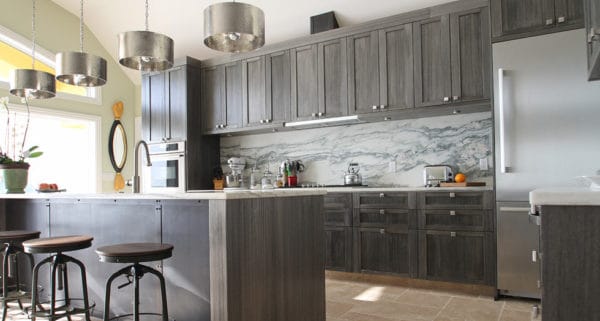 install unique light fixtures to elevate the grey-stained kitchen cabinets in your contemporary home