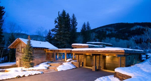 cozy breezeway design and detached garage for a more rustic feel in this mountain house