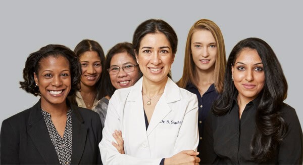 NYC Dentist - Dr Sandip Sachar and her Team at Sachar Dental Dentist NYC - Dr. Sachar with her team of dental assistants and administrative staff all smiling at Sachar Dental