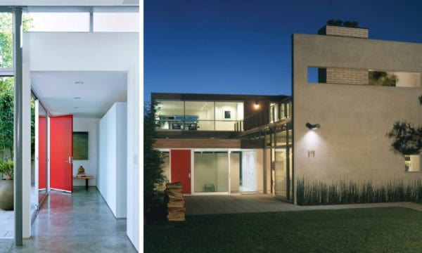 go for a minimalist house with simple red doors, concrete gray floors, and white walls