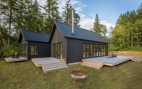 create a rustic exterior featuring vertical rough sawn cedar siding in dark charcoal