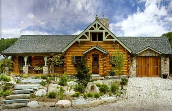 use salvaged wood for the front door of a traditional stone exterior log cabin