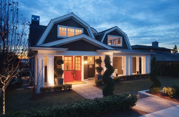 dutch colonial house featuring red double front doors with elegant glass panes