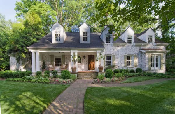 pair dark yellow shutters with white trim for a sweet look and charming cottage house vibe