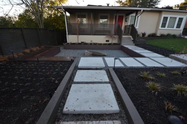 consider a clean modern front yard with corten steel retaining wall and open play areas