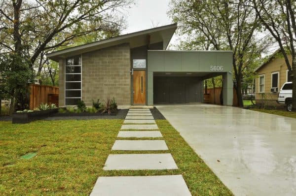 simple concrete carport for a modern mid-century house and timeless front