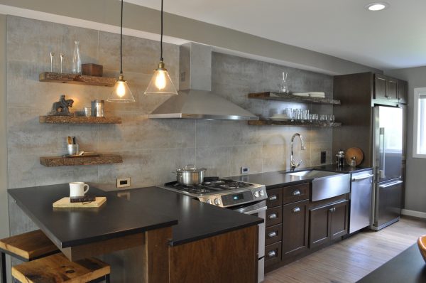 evoke a cozy, earthy ambiance in this small kitchen with a peninsula as well as wood and metallic surfaces