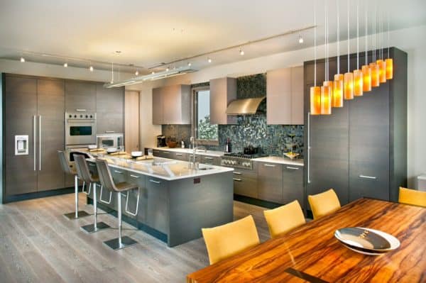 create a bright and modern kitchen with grey-stained oak cabinets and stainless-steel appliances