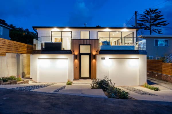 combine vertical cedar siding with smooth white stucco and metal seam roof for a modern cottage aesthetic