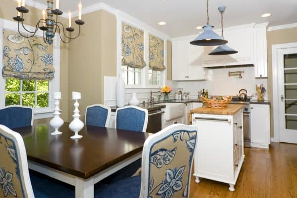 farmhouse style kitchen with muted yellow and steel blue furniture