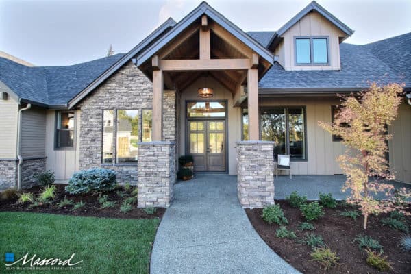 sycamore tan house with a dark wood front door equals to rustic yet classy