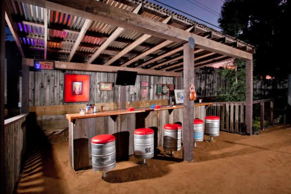 corrugated metal pergola for a mountain-style patio with retro decor and cedar structure