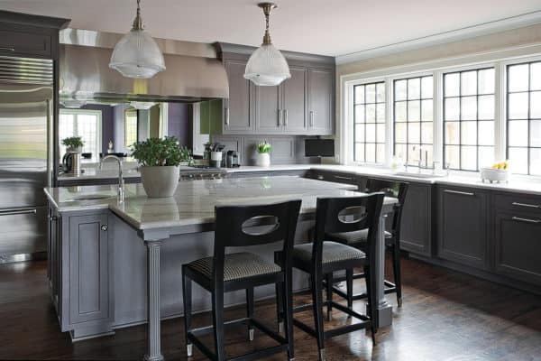 complement grey-stained walnut cabinets with dark wood floor for a classically elegant eat-in kitchen