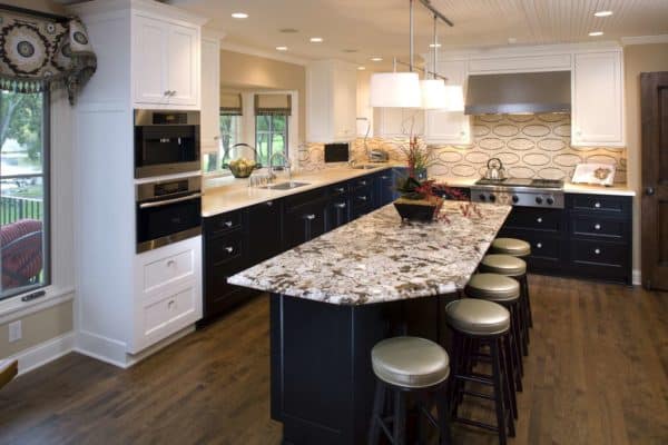 create a trendy kitchen with curtains over the kitchen bay window and beige backsplash design