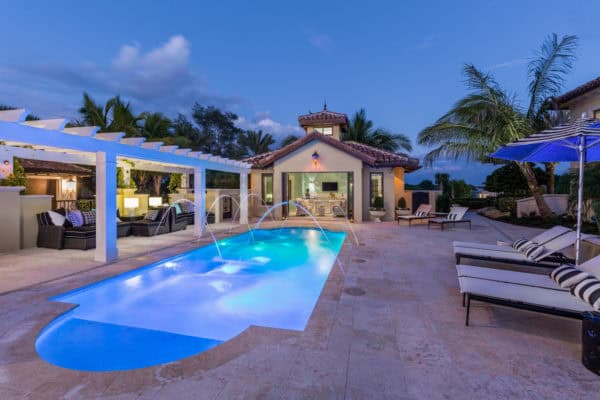 unique lighting and water features to highlight an urban pool and the gorgeous house with bathroom