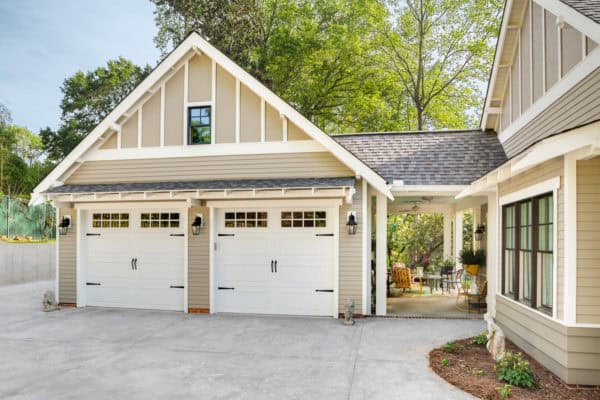 use breezeway as semi-outdoor nook in a craftsman mountain home with detached garage