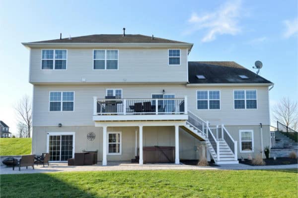 create an extended hosting space on your second-story deck featuring an outdoor grill