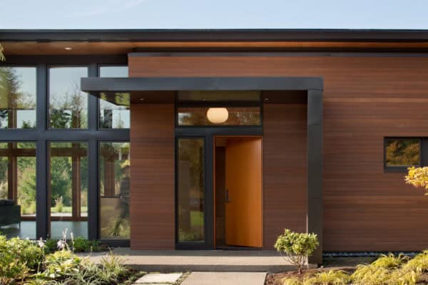 try a modern entry with roof over the door to embody beachside contemporary home design