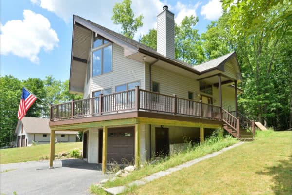 try a stunning yet rustic wrap around second-story deck that connects with the main entryway