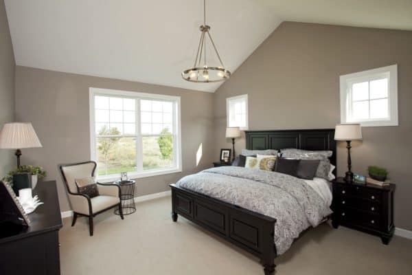 go for traditional bedroom charms through ornate black furniture and patterned grey sheets