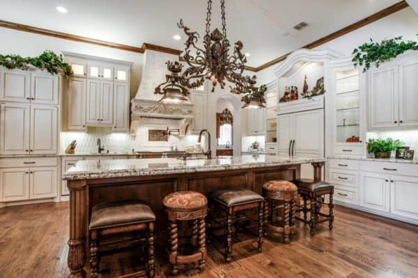 recreate victorian opulence in a fabulous kitchen featuring white cabinets and exquisite brown leather stools